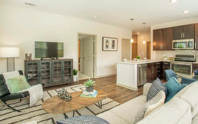 a living room with a tv couch and a table