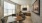 A conference room with tables and a large window