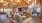 Spacious clubroom with wood floors and large windows'