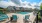 a pool and chairs on a deck